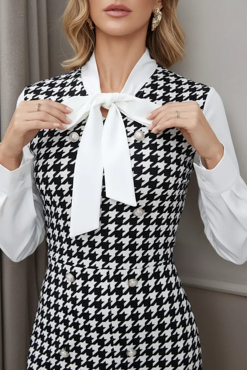 Close-up of houndstooth dress tie neck bow detail - elegant fashion photography